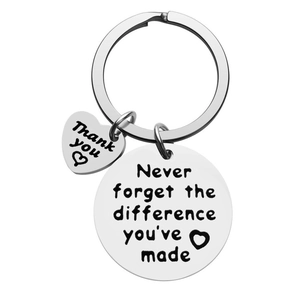 Polished stainless steel retirement keychain with heart charm and motivational engraving