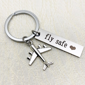 Stainless steel airplane keychain with engraved fly safe charm and heart pendant