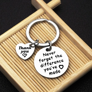Silver stainless steel retirement keychain with engraved inspirational quote and heart charm