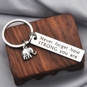 Close-up of elephant keychain with Never forget how STRONG you are motivational engraving