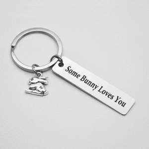 Detailed macro view of silver stainless steel keychain with Some Bunny Loves You engraving