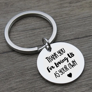 Macro shot of silver stainless steel keychain with engraved thank you message for family