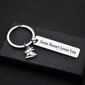 Some Bunny Loves You stainless steel keychain with bunny charm on a black gift box