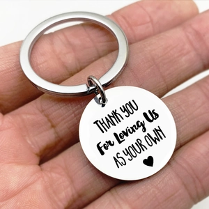 Macro view of stainless steel keychain with Thank You For Loving Us laser engraving