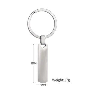 Minimalist stainless steel rectangular bar keychain with measurements 39mm by 9mm