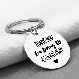 Macro shot of stainless steel keychain engraved with Thank You For Loving Us message