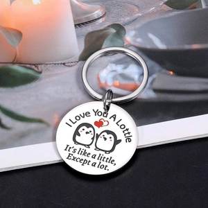 Polished stainless steel penguin heart keychain with I Love You A Lottle engraving