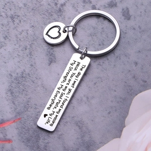 Rectangular stainless steel keychain with heart charm and sentimental love quote engraving