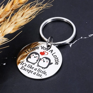 Polished stainless steel keychain with laser-engraved penguins and romantic I Love You message