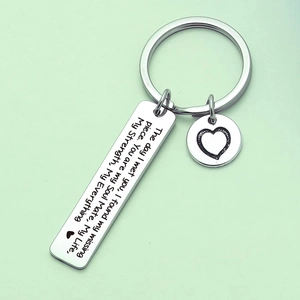 Polished stainless steel rectangular keychain with heart charm and engraved message