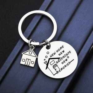 Polished silver stainless steel house keychain with engraved New Home New Adventure message