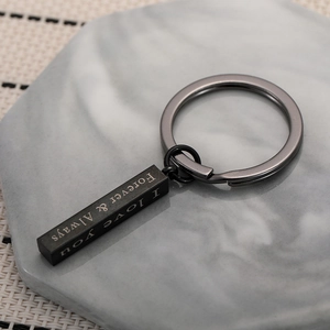 Minimalist black stainless steel bar keychain with Forever and Always engraved on it