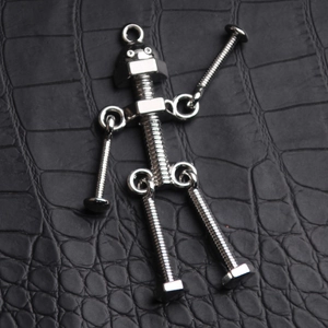 Creative silver screw robot keychain with movable limbs on a black leather background