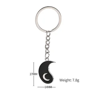 Minimalist moon crescent metal keychain in black with silver lunar charm and ring