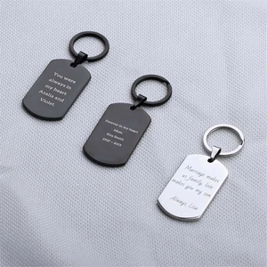 Custom engraved stainless steel dog tag keychains in black and silver with laser text