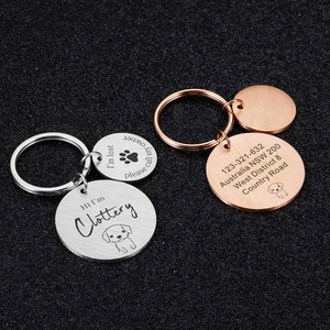 Custom engraved stainless steel pet ID tags with keychains in silver and rose gold finishes