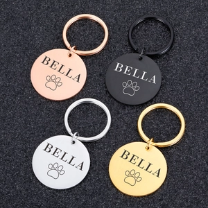 Custom engraved stainless steel pet ID tags in rose gold, black, silver, and gold colors