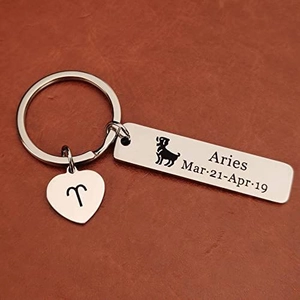 Polished stainless steel Aries zodiac keychain with heart charm on brown leather