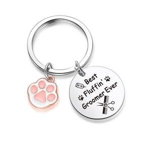 Silver Dog Groomer keychain featuring a pink paw charm and engraved round pendant