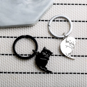 Cute black and white hugging cat keychains in polished stainless steel for couples