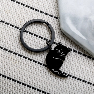 Minimalist black cartoon cat stainless steel keychain with white line details