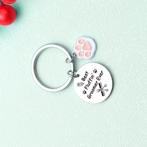 Dog Groomer keychain with pink paw charm and Best Fluffin' Groomer Ever engraved disk