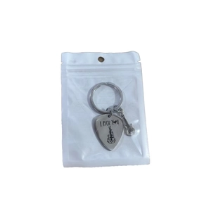 Guitar pick keychain with I Pick You engraving and small guitar charm in silver finish