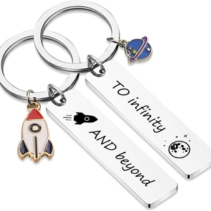 Space themed couple keychains with rocket planet pendants and engraved infinity quote
