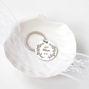 Polished Best Mom Ever stainless steel keychain on a white shell plate mother's day gift