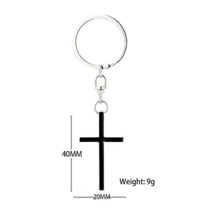 Minimalist silver metal cross keychain with black enamel pendant and dimensions 40x20mm