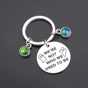 Ghost stainless steel keychain with green and blue crystals and engraved quote