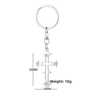 Detailed size view of silver gothic cross keychain with clear crystals and secure clasp
