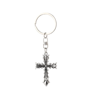 Detailed view of Gothic thorn cross keychain with vintage silver finish and relief texture