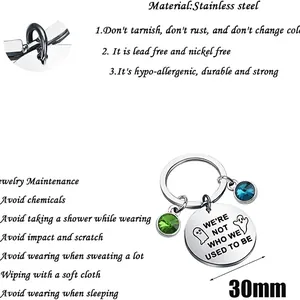 Ghost stainless steel keychain with green and blue gems and engraved quote charm
