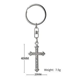 Sparkling cross keychain with white rhinestones and silver-plated alloy for backpacks
