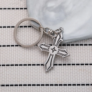 Vintage antique silver cross metal keychain with intricate carved pendant and star center