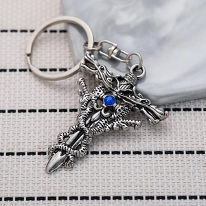 Retro gothic dragon sword keychain with blue sapphire cross on silver metal background