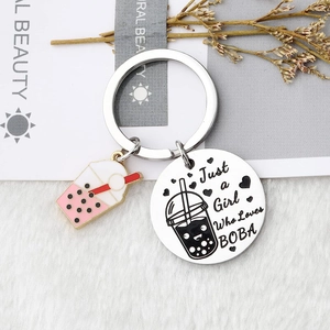Stainless steel bubble tea keychain with pink charm and Just a Girl Who Loves BOBA engraving