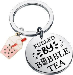 Macro shot of stainless steel keychain with fueled by bubble tea engraved metal charm
