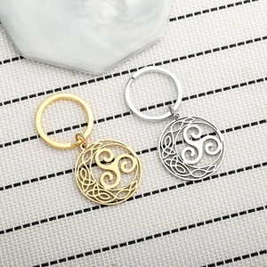 Detailed view of gold and silver Triskele Celtic knot stainless steel keychains