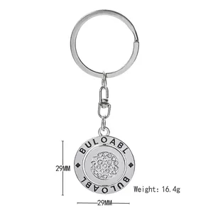 Rotating silver metal keychain with sparkling rhinestones and 29mm engraved pendant