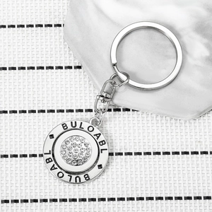 Rotatable Round Metal Keychain With White Rhinestone Engraved Letter Alloy Keyring For Women Fashion Bag Pendant Accessories
