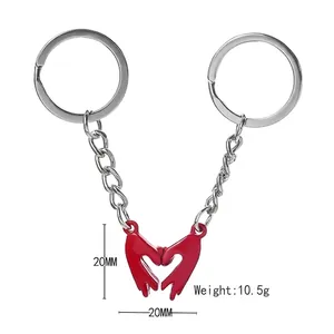 Magnetic heart gesture couple keychain in silver metal with red enamel hand charms