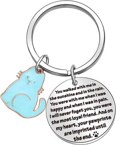 Close-up of stainless steel cat memorial keychain with engraved sentimental quote