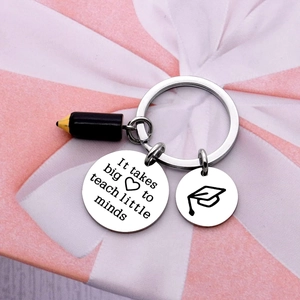 Teacher appreciation keychain with engraved heart message, cap charm, and pencil on gift box