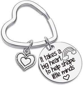Close-up of heart keychain with teacher appreciation quote and rainbow engraving
