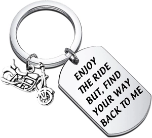 Detail view of motorcycle keychain with shield pendant and engraved inspirational quote
