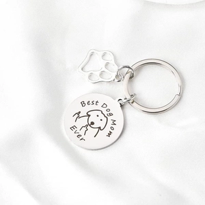 Silver stainless steel Best Dog Mom Ever keychain with paw charm on white silk