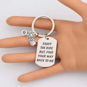 Polished stainless steel motorcycle keychain engraved with Enjoy The Ride quote