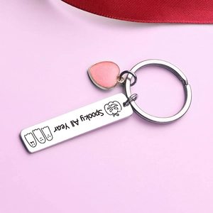 Porte-clés Spooky All Year en acier inoxydable avec cœur rose pailleté sur fond violet